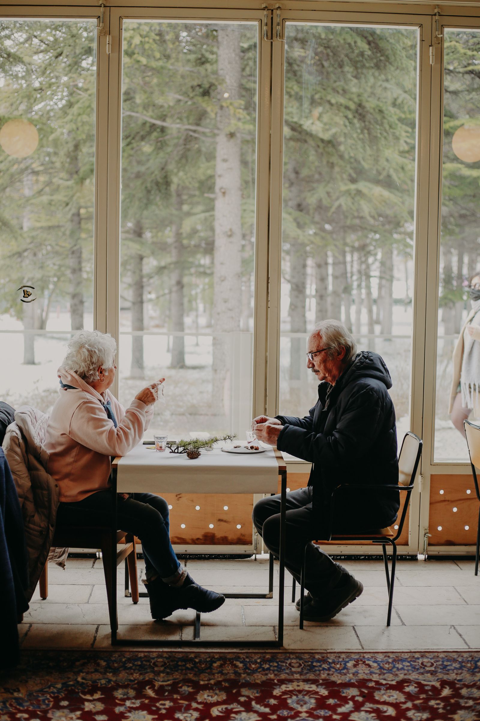 Older adults comparing prepared meal options in a residence dining room